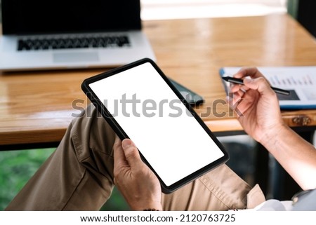 Close up. Man holding tablet blank white screen for text message or information. Mock up.