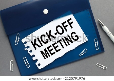 Kick-off meeting Message. clipboard with white blank sheet of paper on gray isolated Royalty-Free Stock Photo #2120791976