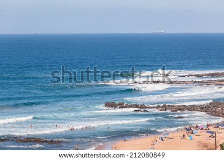 Ocean Beach Coves Landscape Overlooking ocean sea waves in rocky beach coves with distant swimmers