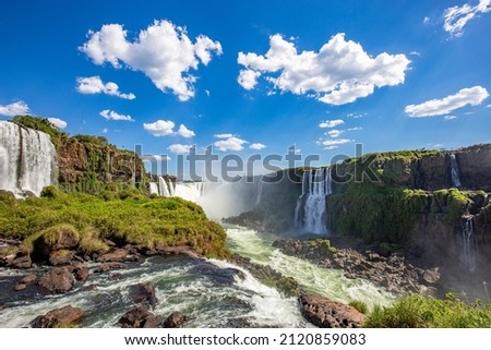 View of the Iguazu Falls, border between Brazil and Argentina. The falls are one of the seven wonders of the world and are located in the Iguaçu National Park, a UNESCO World Heritage Site. Royalty-Free Stock Photo #2120859083