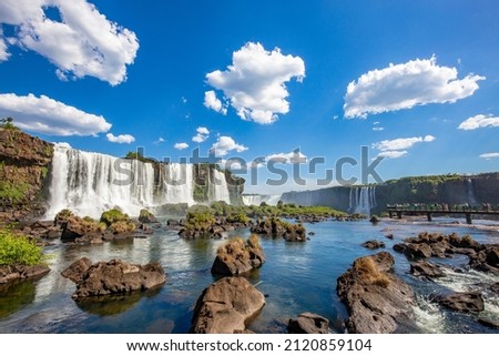 View of the Iguazu Falls, border between Brazil and Argentina. The falls are one of the seven wonders of the world and are located in the Iguaçu National Park, a UNESCO World Heritage Site. Royalty-Free Stock Photo #2120859104
