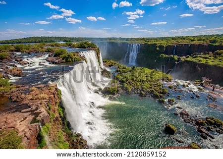 View of the Iguazu Falls, border between Brazil and Argentina. The falls are one of the seven wonders of the world and are located in the Iguaçu National Park, a UNESCO World Heritage Site. Royalty-Free Stock Photo #2120859152