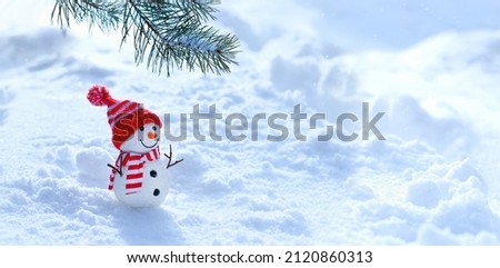 Christmas background. cute snowman and pine tree branch in snow. New Year and Christmas holidays. festive winter season. banner. copy space. template for design