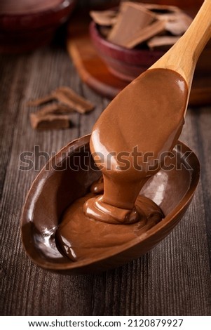 Chocolate Easter egg filled with chocolate ganache. Royalty-Free Stock Photo #2120879927