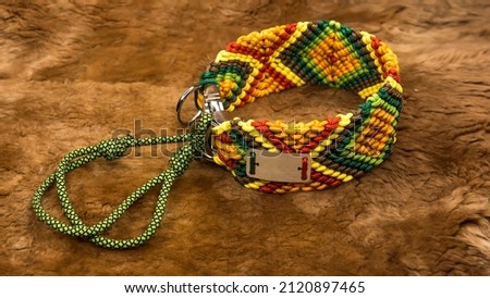 Collar with a pattern. Bright color. On a brown background
