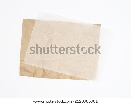Abstract brown recycled crumpled paper and crumpled tracing paper isolated on white background. Royalty-Free Stock Photo #2120905901