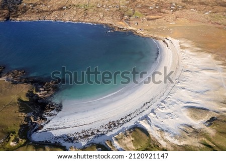 Aerial view on amazing Dog's bay beach near Roundstone town in county Galway, Sandy dunes and beach and blue turquoise color water. Cloudy sky. Popular travel destination. Gem of Connemara Royalty-Free Stock Photo #2120921147