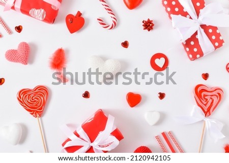 Background with red accessories for a festive Valentine's Day. Banner for February 14. Valentine's Day greeting card. Copy space. Flat lay, top view.