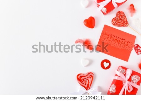 Background with red accessories for a festive Valentine's Day. Banner for February 14. Valentine's Day greeting card. Copy space. Flat lay, top view.