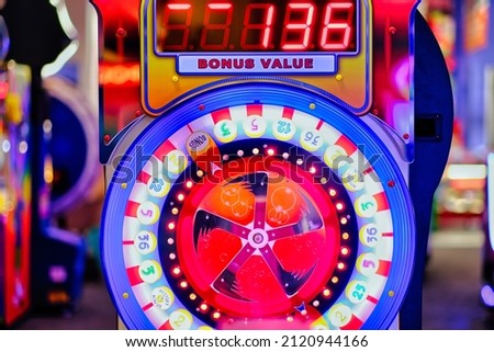 Colorful spin wheel of fortune game with digital score display. Casino, lottery, playground, amusement park, fun game and birthday party event background.