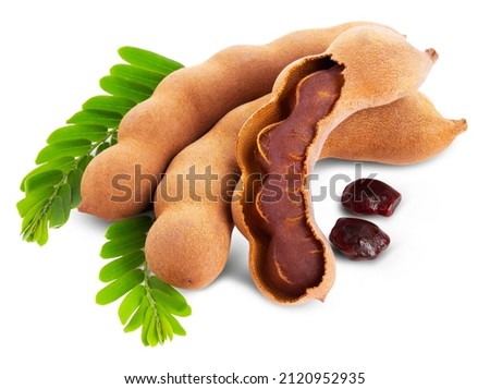 Tamarind fruits with green leaves isolated on white background. Royalty-Free Stock Photo #2120952935