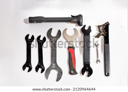 Tools needed for bicycle repair on a white background