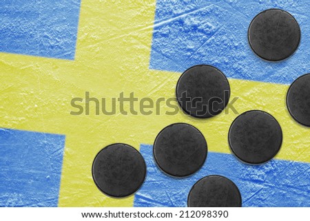 Washers and the image of the Swedish flag on a hockey rink