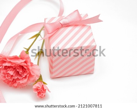 Artificial carnation flowers and gift boxes