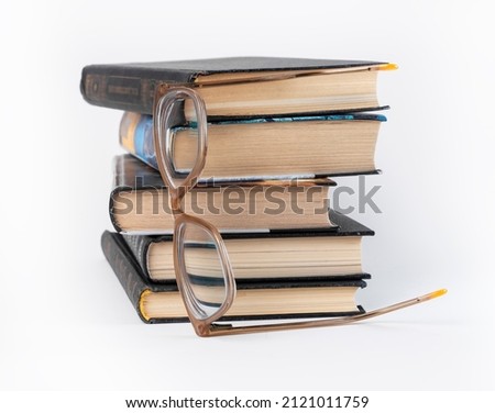 Books stack with eyeglasses. Education, reading leisure, data search, getting knowledge concept. High quality photo