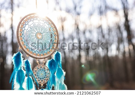 Dream catcher with feathers threads and beads rope hanging. Dreamcatcher handmade Royalty-Free Stock Photo #2121062507