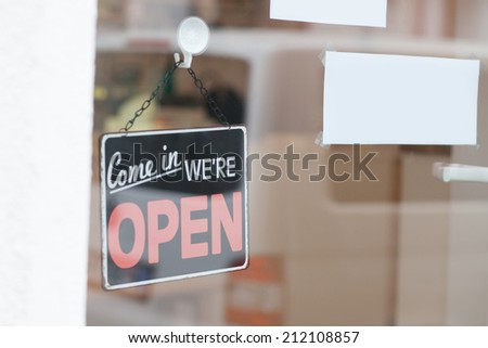 open sign at window shop