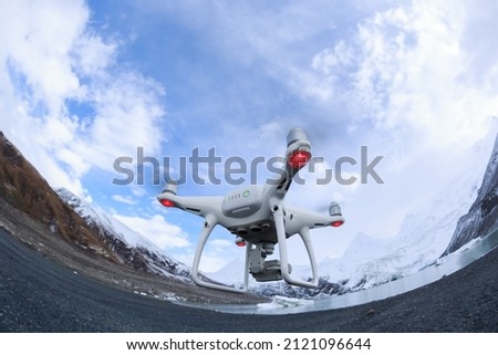 Flying drone taking picture of landscape in Tibet,China