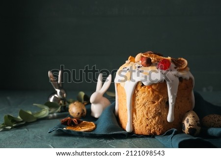Delicious Easter cake and eggs on table Royalty-Free Stock Photo #2121098543