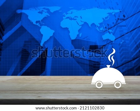 Restaurant cloche flat icon on wooden table over world map, modern city tower and skyscraper, Business food delivery online service concept, Elements of this image furnished by NASA