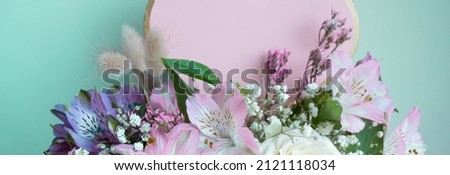 
Banner with bouquet pink lilies, gypsophiles. Turquoise background. Love Valentines copy space