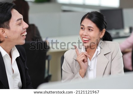 Business people gossiper group whispering or sharing rumor about their colleague in the office. Female coworker sitting and telling gossip to male workmate about bullying problem at work place