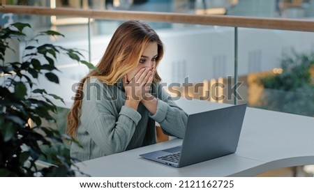 Caucasian stressful business woman with laptop frelancer girl frustrated shocked reading bad online news email failed test exam results reads unexpected terrible information upset problem notification Royalty-Free Stock Photo #2121162725