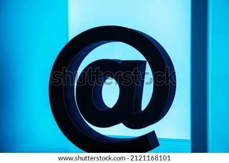 at sign or address sign the symbol in an E-mail address that separates the name of the user from the user's Internet address, or in social networks accounts
