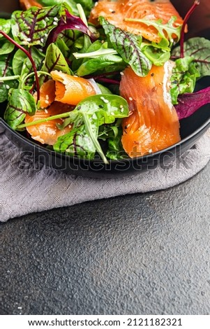 salad salmon slices green salad mix seafood fresh portion dietary healthy meal food diet snack on the table copy space food background keto or paleo  vegetarian food no meat pescatarian diet Royalty-Free Stock Photo #2121182321