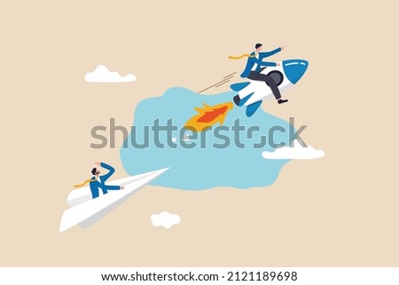 Leadership to win business competition, winner or competitive advantage to success in work, innovation and motivation concept, businessman riding fast rocket to win against other origami airplane. Royalty-Free Stock Photo #2121189698