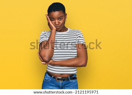 Young african american woman wearing casual clothes thinking looking tired and bored with depression problems with crossed arms. 