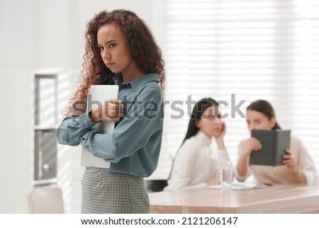 African American woman suffering from racial discrimination at work Royalty-Free Stock Photo #2121206147