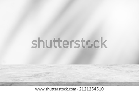 Shadow leaves wall background and cement floor stage well editing display product and text present on free space backdrop 