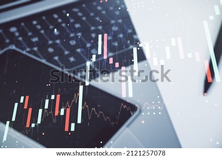 Abstract creative financial graph on modern laptop background, financial and trading concept. Multiexposure