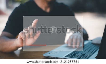 Hands of man using laptop to stream online Watch internet videos,tutorials using your mouse and keyboard to stream online. Watch videos on the Internet, live performances, performances, or tutorials. Royalty-Free Stock Photo #2121258731