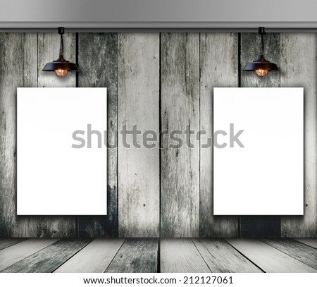 Blank two white poster frame in wooden room and ceiling lamp