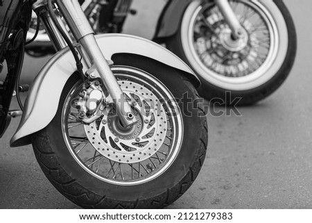 Close view detail of the shiny details of a classic motorcycle. In Black and White