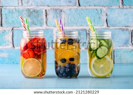 Healthy detox infused water with fruits. Refreshing summer homemade cocktail. Royalty-Free Stock Photo #2121280229