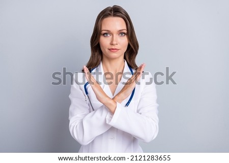 Photo of confident doc ladt cross arms recommend stop covid spread vaccinate isolated grey color background