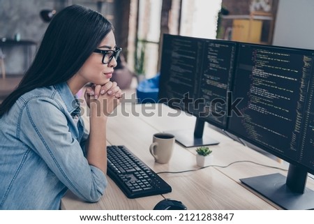Profile side view portrait of attractive focused girl geek research database css linux intranet network at workplace workstation indoors Royalty-Free Stock Photo #2121283847
