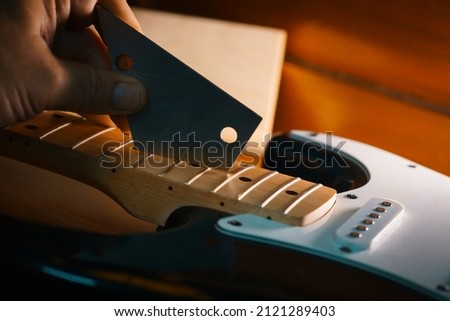 Maintenance electric guitar Black color Royalty-Free Stock Photo #2121289403
