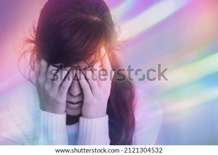 Migraine aura - Portrait of young woman suffering from headache, epilepsy or other problem Royalty-Free Stock Photo #2121304532