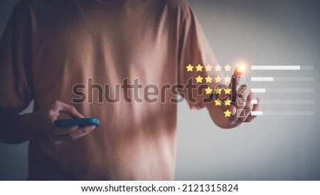 Mobile Satisfaction Scoring Business Image Five-star ratings for customer service satisfaction review feedback. and review scores, reviews, business surveys. Royalty-Free Stock Photo #2121315824