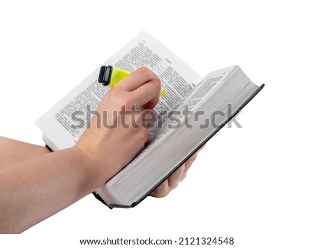 Book highlight. Hand marking important text in book isolated on white background. Education, preparing for exams concept. High quality photo