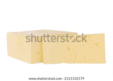 A slice of cheese, with a large piece of cheese isolated on a white background