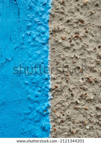 The border of natural pebbles in concrete flooring, anti slip with painted part in blue. Concept image for sustainable or eco living design for interior decoration space.
