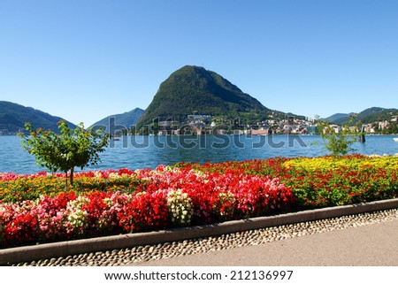 Lugano, Switzerland - Juli 31, 2014: Images of the Gulf of Lugano from Monte Bre above the City. Royalty-Free Stock Photo #212136997