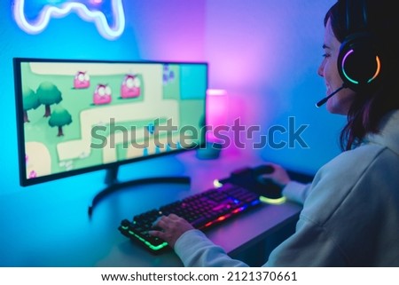 Gamer girl playing and streaming online video games - Metaverse and technology concept Royalty-Free Stock Photo #2121370661