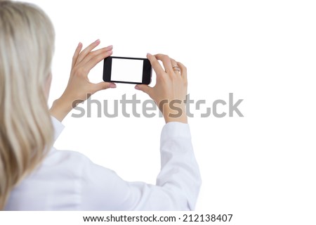 Woman taking photo with mobile phone. Isolated white background for your own image.