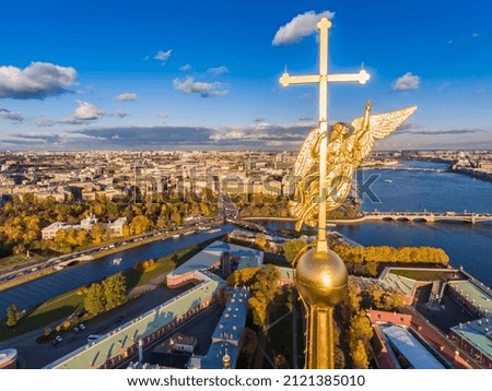 Russia, St. Petersburg, Aerial landscape of Peter and Paul cathedral at sunset, walls of fortress, Golden autumn, panorama landscape, golden spire with cross and angel, drawbridges, river Neva